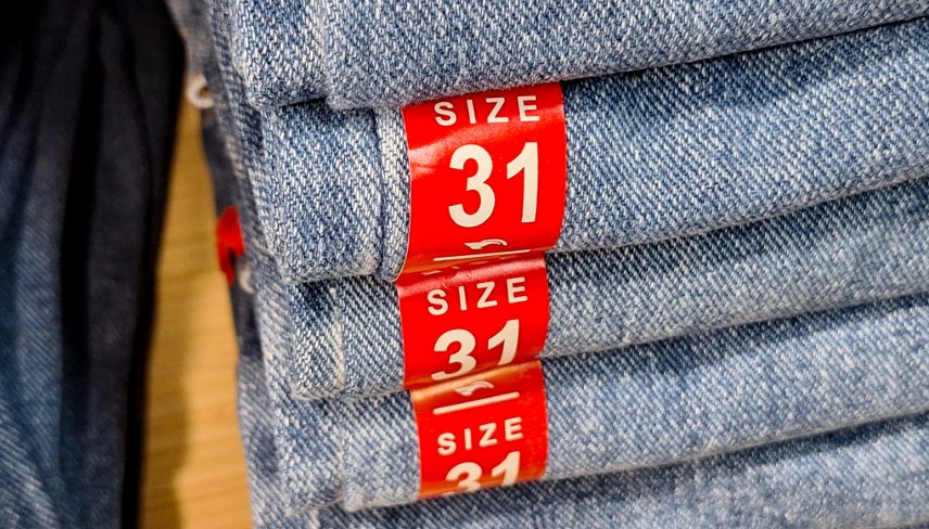Size information stickers on pants sold in clothing stores.